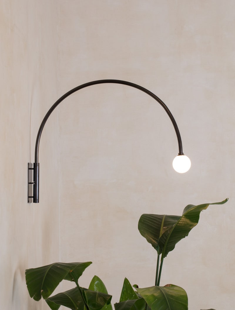 Contour Wall Lamp 22" shown in Blackened Brass, Opal Globe
